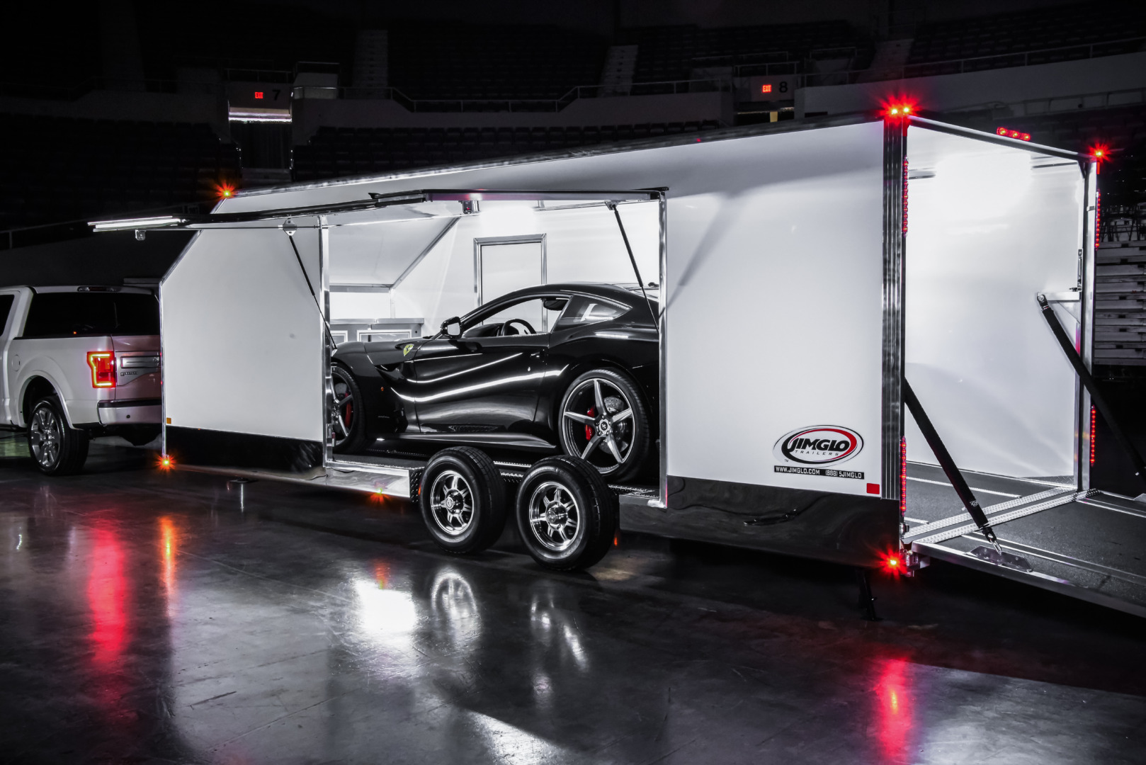 Jimglo Elite Enclosed Car Trailer With Black Ferrari Sports Car Inside.