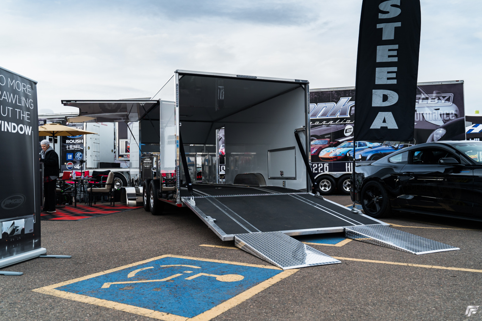 Jimglo Elite Tiltbed Trailer At Barrett-Jackson Next To Steeda