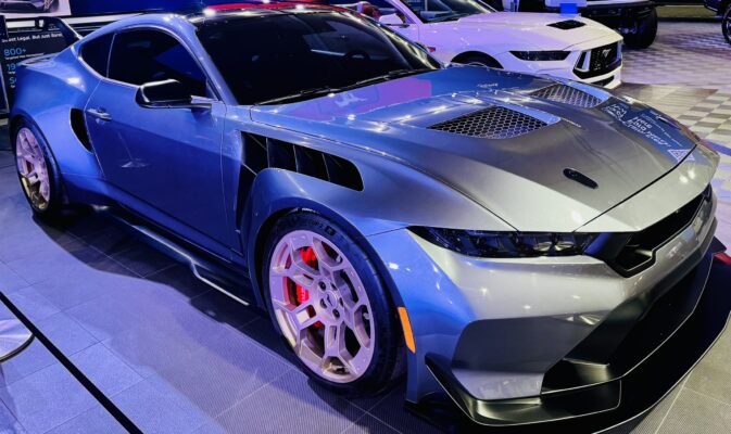 a car parked in a showroom ford mustang gtd